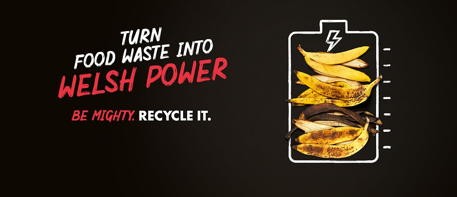 Chalk drawing of a battery with banana skins inside on a black background with the caption: Turn food waste into Welsh power. Be Mighty. Recycle it.