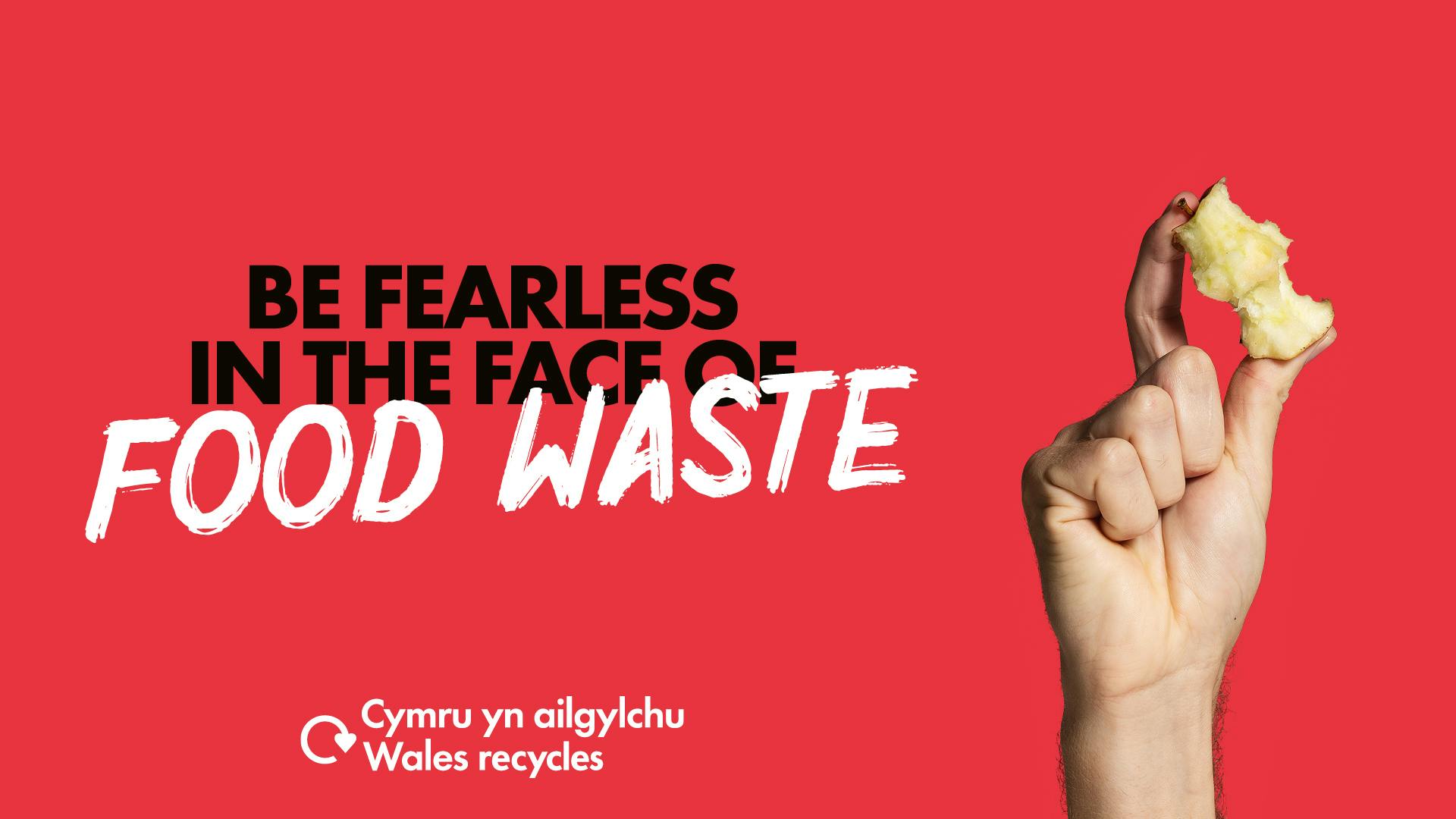 White hand holding an apple core with the caption "Be fearless in the face of food waste"