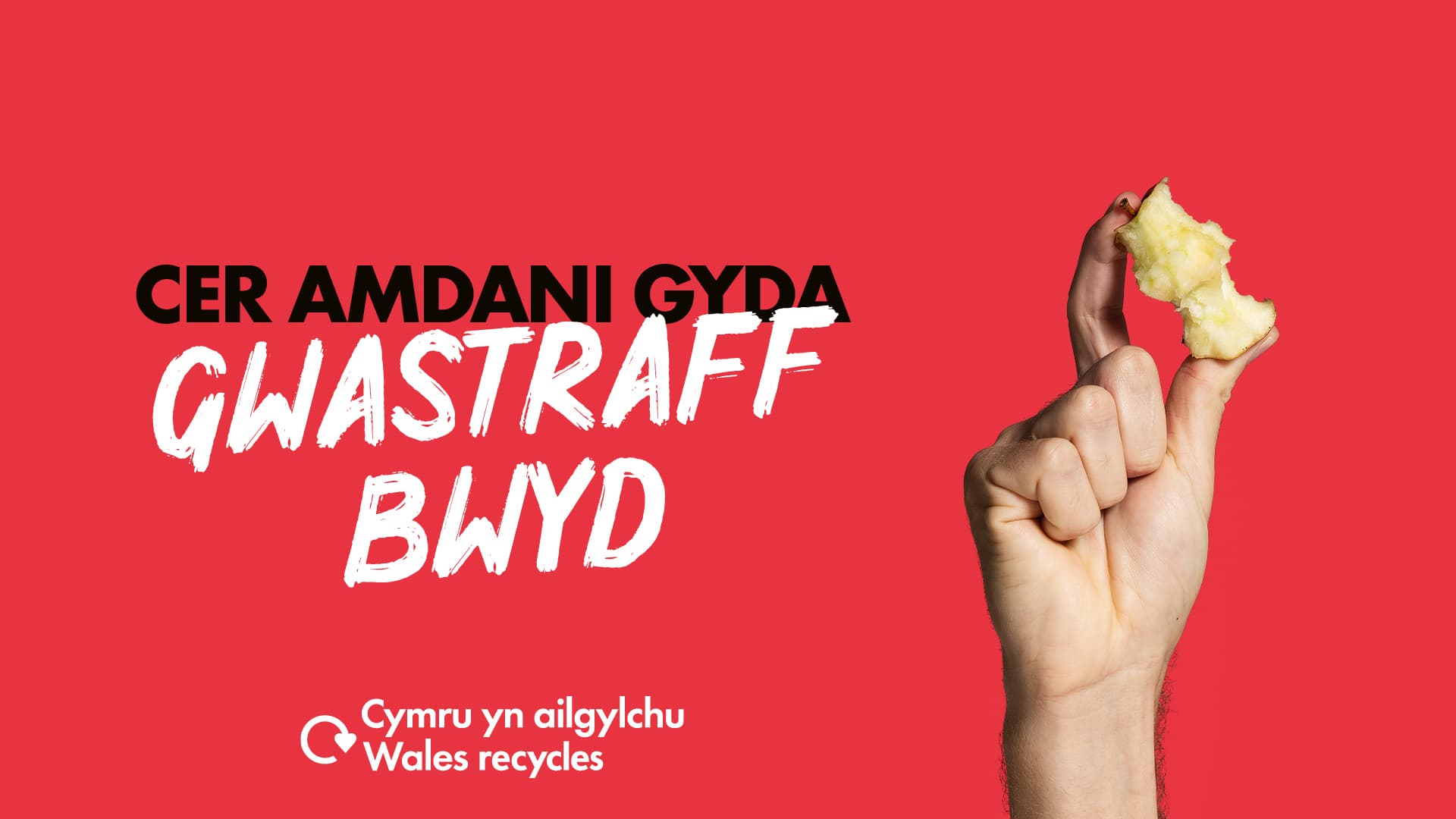 Llaw gwyn yn ddal craidd afal gyda'r geiriau "Cer amdani gyda gwastraff bwyd"